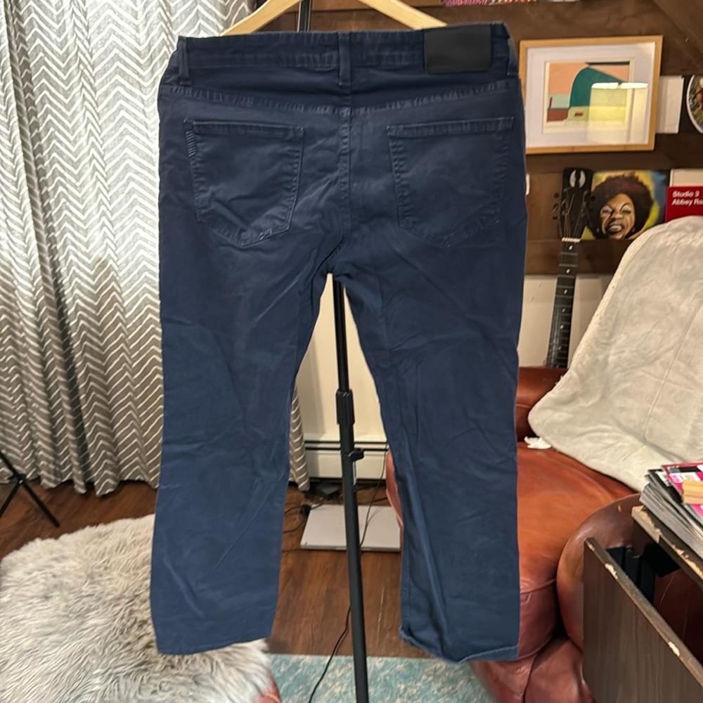 Blue Paige chino pants. Some stitching coming out on back pocket.